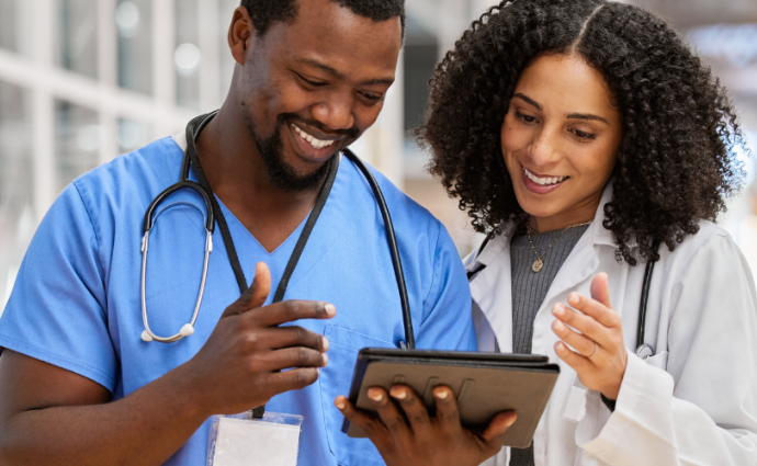 Physicians reading a tablet